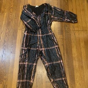 Fun and flirty rose gold and black jumpsuit. Perfect for New Years Eve!